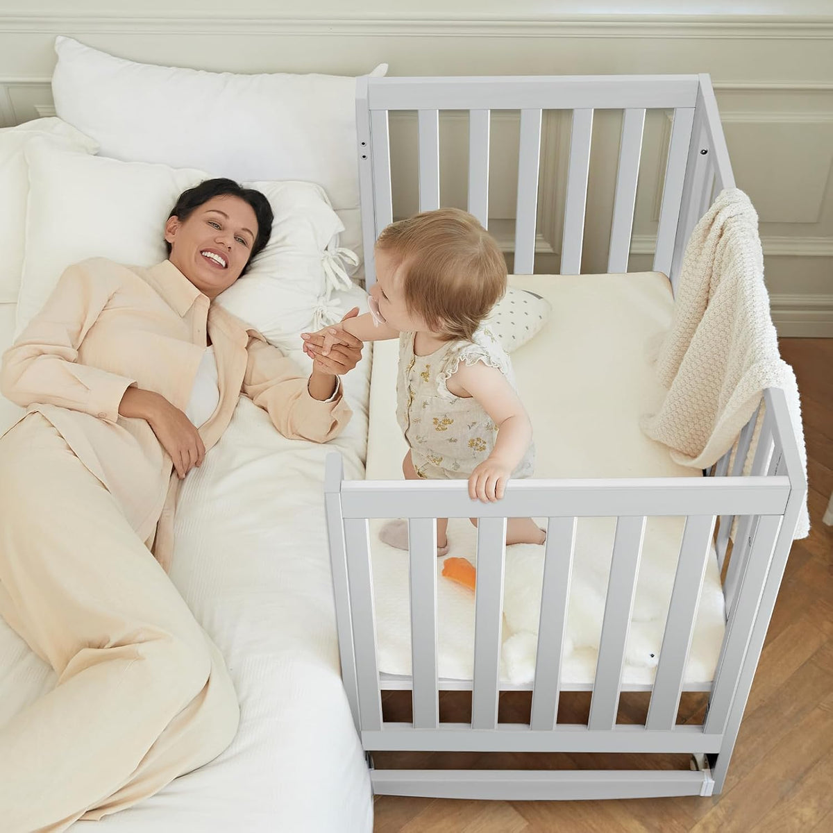 EvoNest Baby Crib, 6 in 1 Convertible Mini Crib with Wheels, 100% New Zealand Pinewood Growing Bed, 4 Adjustable Mattress Height， (Milk)